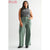 Woman wearing green pants and a gray sleeveless top on a white background