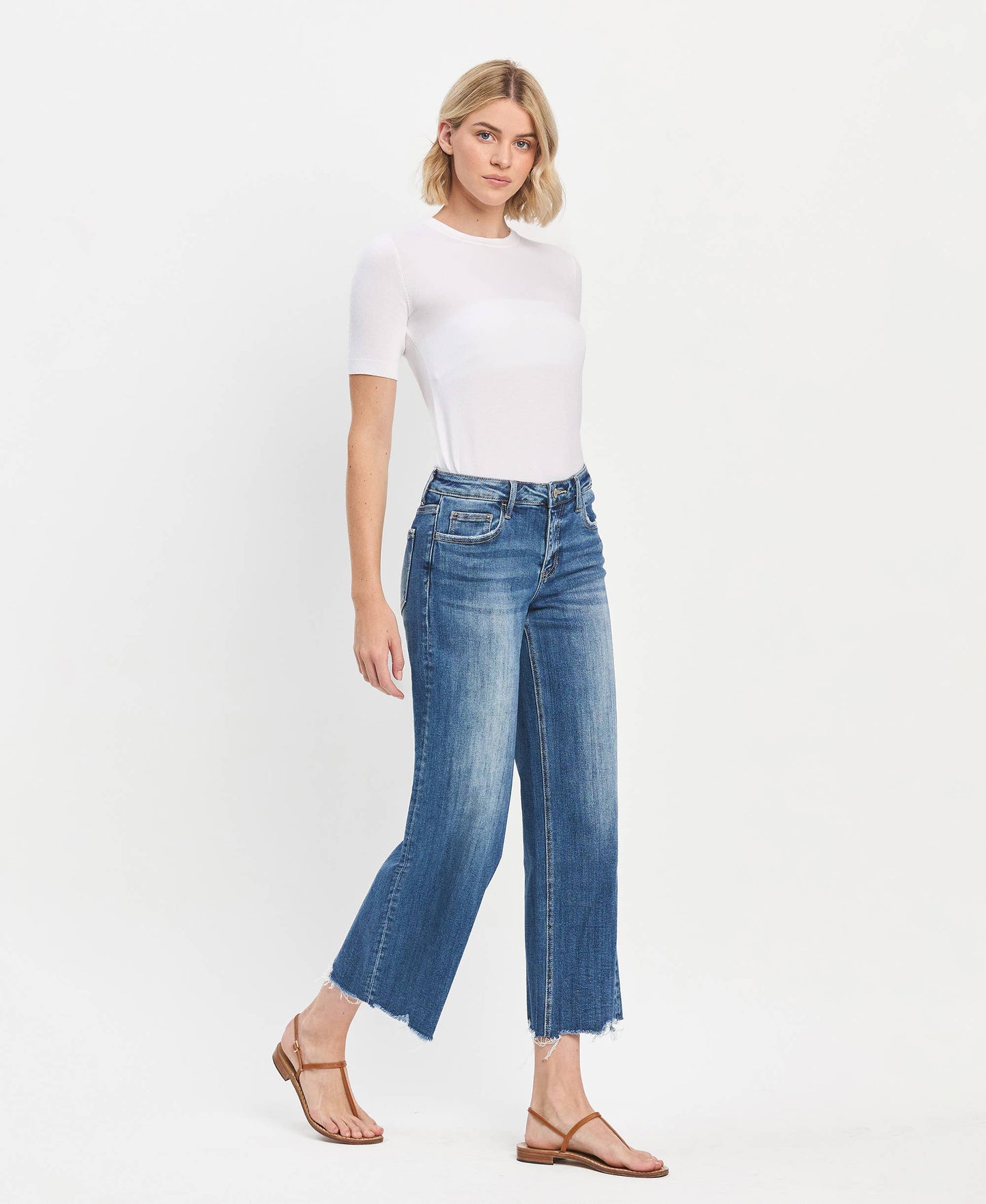 Mid Rise Raw Hem Medium Wash Wide Leg Denim by Lovervet