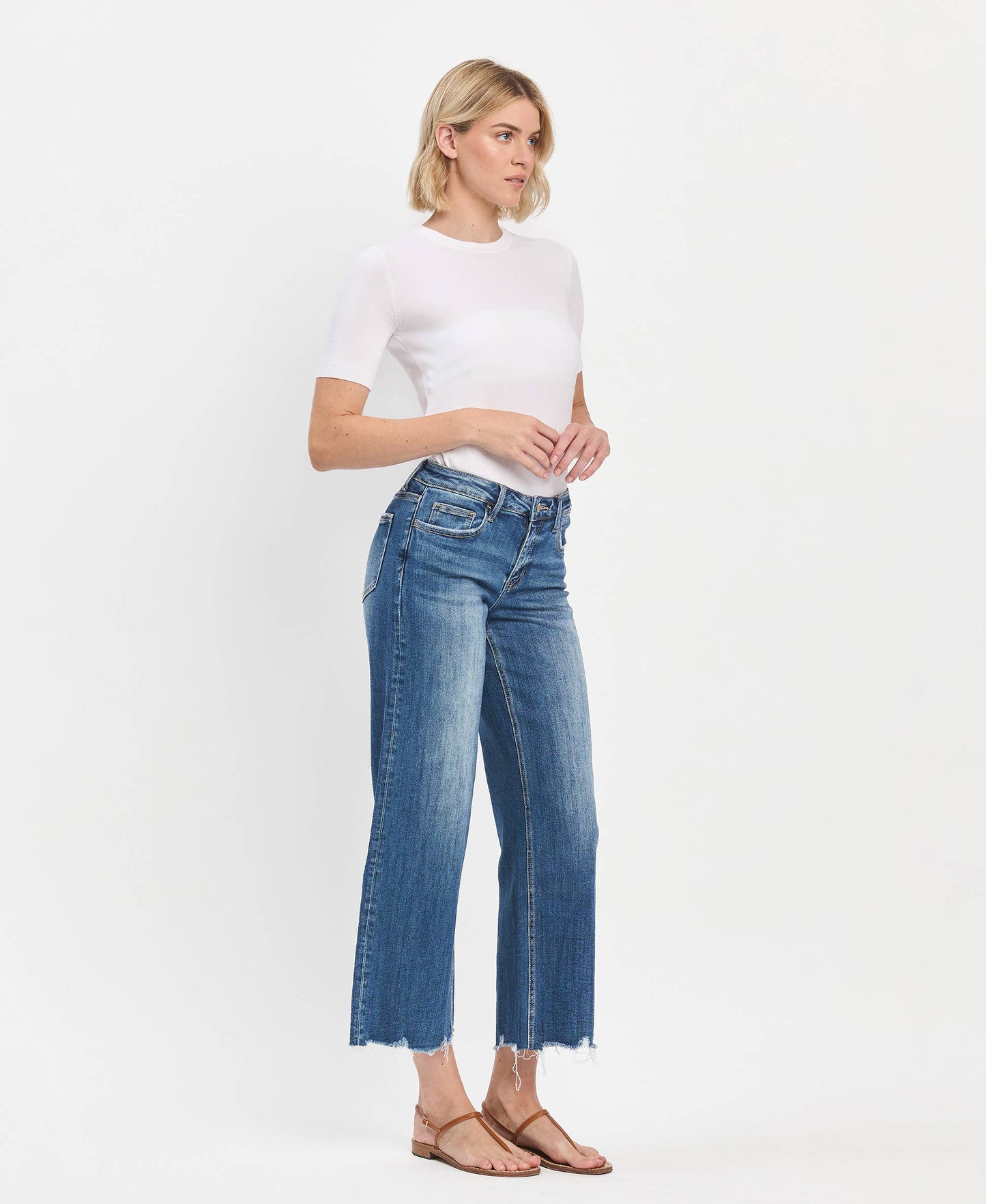 Mid Rise Raw Hem Medium Wash Wide Leg Denim by Lovervet