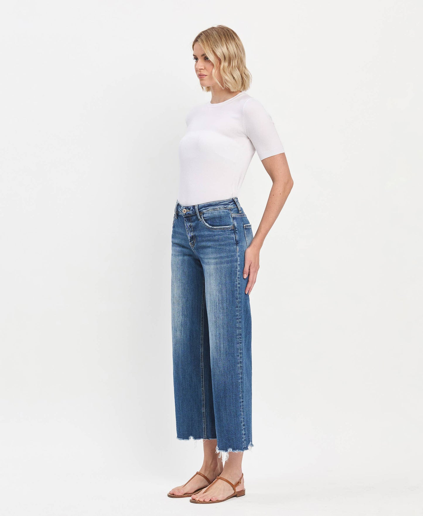 Mid Rise Raw Hem Medium Wash Wide Leg Denim by Lovervet