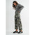 Woman wearing a gray sweater and camouflage pants on a white background