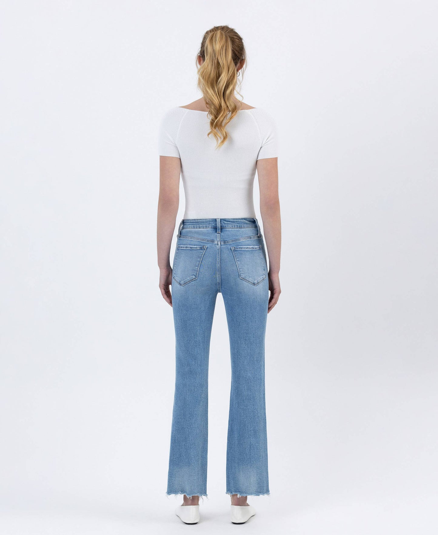 High Rise Light Wash Uneven Raw Hem Kick Flare Denim by Lovervet